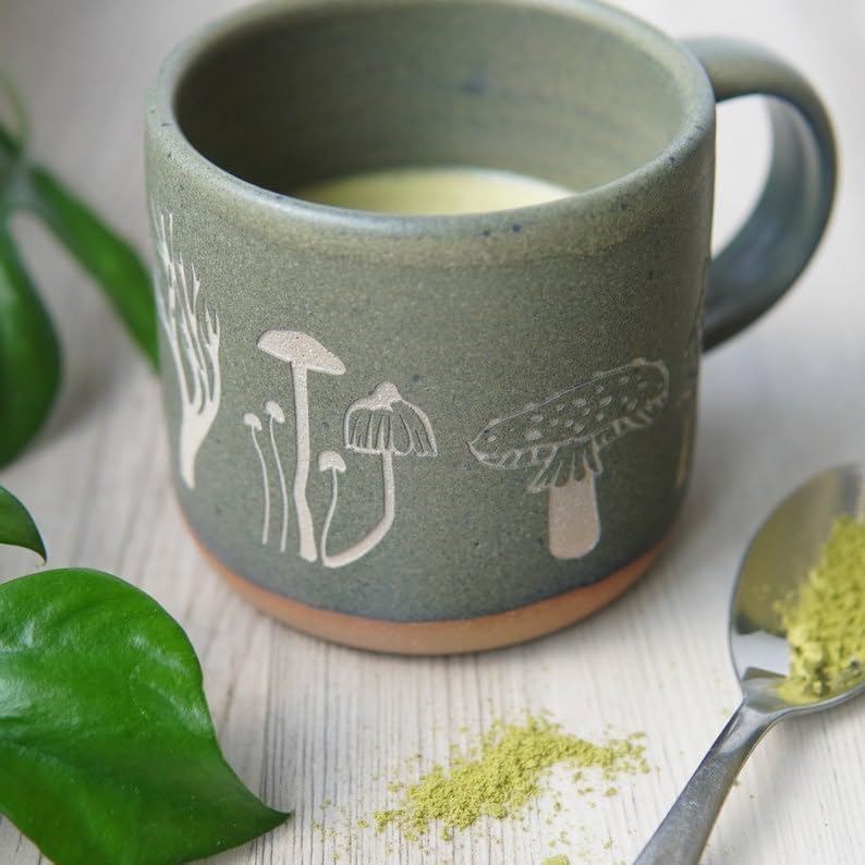 Mushroom Collection Mug a beautifully engraved pottery piece, showcases intricate designs inspired by nature's fungi.