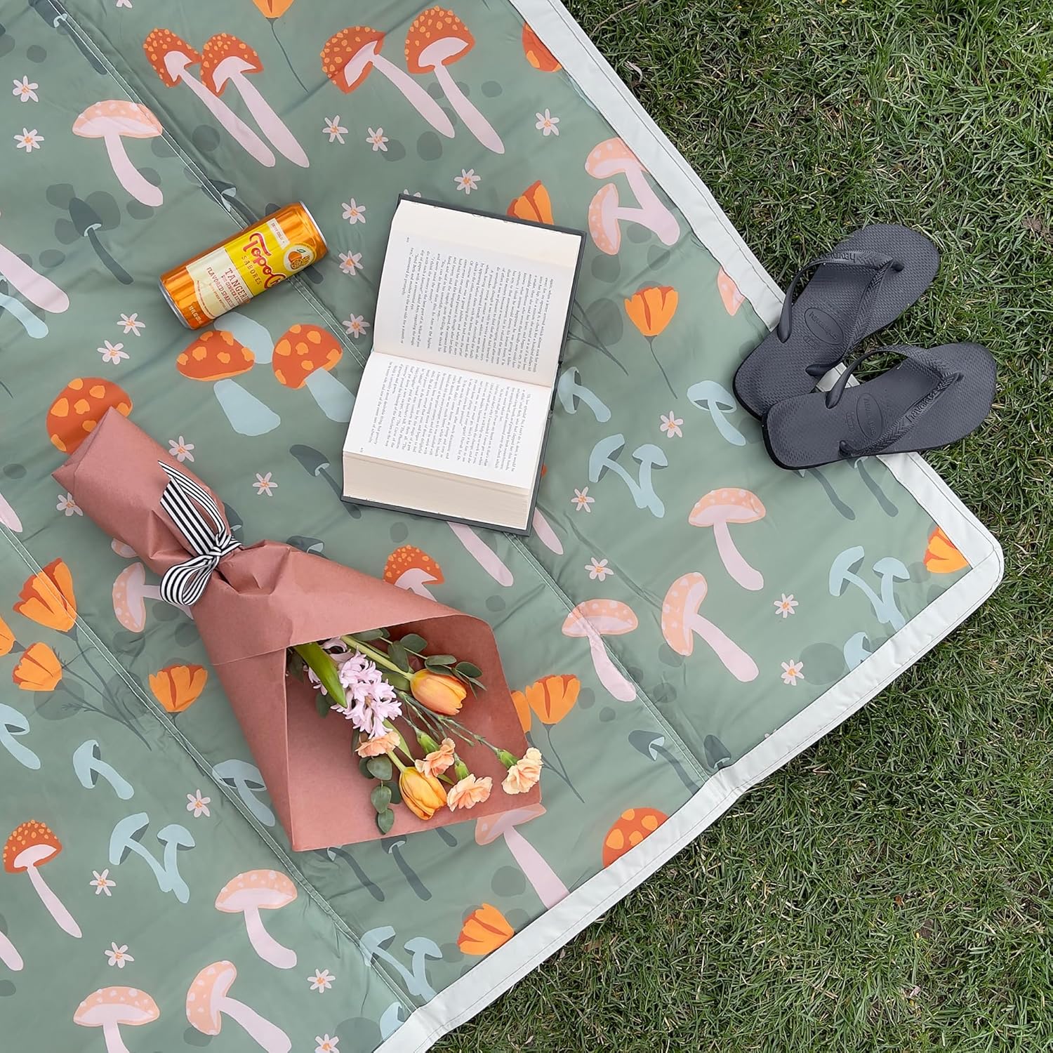 1746014566_91ElkhfVbSL._AC_SL1500_.jpg Little Unicorn 5'x5' Outdoor Family Picnic & Beach Blanket | Durable & Water-Resistant Fabric | Compact Fold & Easily Wipes Clean | Zipper Pocket (Woodland Mushroom) - Image 3