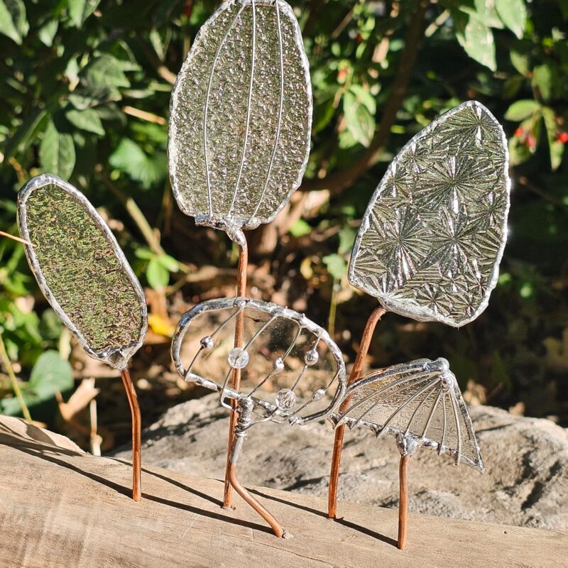 Whimsical Stained Glass Mushrooms on Driftwood